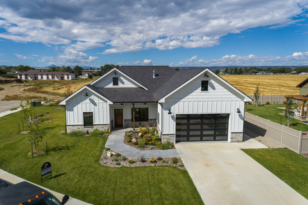 A drone shot of a home with finished landscaping built by Harvells Homes in Cottonwood Village